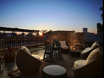 EcoSmart Fire Stix 8 Fire Pit adds eco-friendly ethanol warmth to a private residence deck, outdoor heating centrepiece.