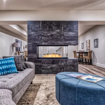 EcoSmart Fire Flex 50PN Flex Fireplace adds a modern ethanol peninsula hearth in a private living room, ventless luxury.
